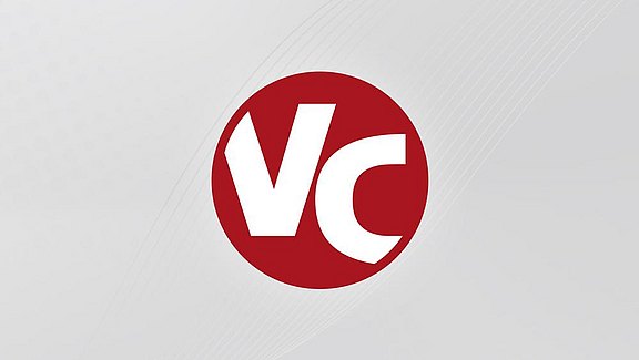 ViCADo Logo - ein roter Kreis mit den weißen Buchstaben V und C. Hier ist es auf einem rechteckigen grauem Hintergrund abgebildet.  